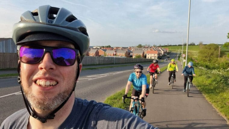 5 cyclists using a cycle path